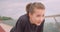 Closeup portrait of young cheerful sporty female jogger in a black t shirt getting motivated and starting to run on the