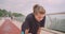 Closeup portrait of young cute sporty female jogger in a black t shirt getting motivated and starting to run on the