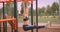 Closeup portrait of young pretty sporty fitness girl making exercises on the athletic field in urban city outdoors