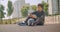 Closeup portrait of young strong African American male basketball player listening to music in vibes on his phone