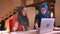 Closeup portrait of young successful muslim businesswomen discussing the work issues in front of the laptop. The