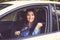 Closeup portrait of young woman fasten seat belt