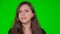 Closeup portrait, young woman yawns and looks bored around isolated on green screen