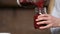 Closeup pouring beet smoothie from blender to jar