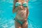 Closeup of pregnant woman in pool underwater stand