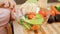 Closeup of pregnant yougn woman mixing vegetables in fresh tasty salad on kitchen. Concept of healthy lifestyle and