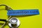 Closeup prevetion cure with stethoscope concept inspiration on yellow background