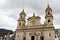 Closeup of the Primatial Cathedral against a cloudy sky in Bolivar Square, Bogota