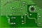 Closeup printed circuit board green there are a lot of conductive tracks