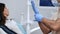 Closeup professional male dentist put on blue protective rubber gloves patient consult checkup