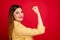 Closeup profile photo of attractive lady showing perfect shape strong fist muscle symbolizing girls power concept wear