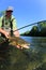 Closeup of proud fisherman with trout