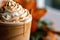 Closeup Of Pumpkin Spiced Frappuccino With Whipped Cream. Generative AI