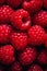 Closeup of raspberries sitting on top of each other