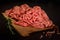 closeup raw minced meat served with spices and rosemary