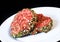 Closeup of raw red hamburgers on white plate