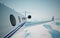 Closeup of realistic photo white, luxury generic design private jet flying over the earth`s surface.Modern airplane and empty blue