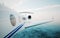 Closeup of realistic photo white, luxury generic design private jet flying over the ocean.Modern airplane and clouds in a sky on