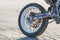 Closeup rear motorcycle wheel and exhaust pipe. Rear wheel motorcycle chain drive