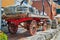 Closeup rear view of vintage classic horse drawn carriage loaded with wooden barrels