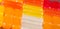 Closeup rectangular colorful shiny hard candy lined up