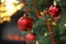 Closeup of red baubles hanging on Christmas tree, space for text. Bokeh effect