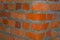 Closeup red brick corner of house wall