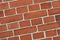 Closeup of a red brick wall with copy space. Detail of recently built exterior masonry or historic design wall