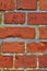 Closeup of red brick wall and copy space on the exterior of a home, house, or city building. Texture, detail of rough