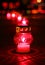 Closeup of red burning votive candle