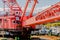 Closeup of red crane on industrial barge