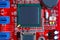 Closeup of red electronic motherboard circuit with processor