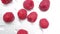 Closeup of red raspberries on rotating plate