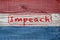 Closeup red, white and blue boards background. with the Word Impeach stamped in the middle