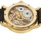 Closeup of rich gold swiss made chronograph watch
