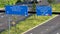 Closeup of a road with cars driving in Schiedam heading to Vlaardingen and Rotterdam, The Netherlands with traffic signs filmed fr