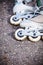 Closeup roller skates on asphalt.