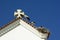 Closeup of a roof with storks nest at church Matriz de Nossa Senhora do Rosario