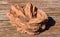 Closeup of rose rock barite rock crystal - Oklahoma State Rock sitting on wood