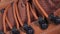 Closeup of rotating pair of fashionable wetherproof leather rufous boots with laces.