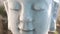 Closeup of rotating stone head of buddha