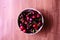 Closeup round sweet red cherries on wooden background