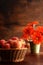 Closeup royal gala apples in old basket with flowers