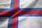 Closeup of Ruffled Faroe Islands Flag, Faroe Islands Flag Blowing in Wind