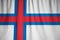 Closeup of Ruffled Faroe Islands Flag, Faroe Islands Flag Blowing in Wind