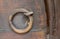 Closeup of rusted ring door knocker
