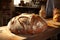 Closeup of rustic sourdough bread on wooden board in sunlit kitchen, creating a warm, inviting scene