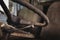 Closeup of a rusty steering wheel of an abandoned car with a blurry background