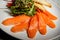 closeup salmon slices served with rucola and tomato salad and toasted bread