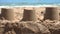 Closeup of sandcastles on the sand of a beach